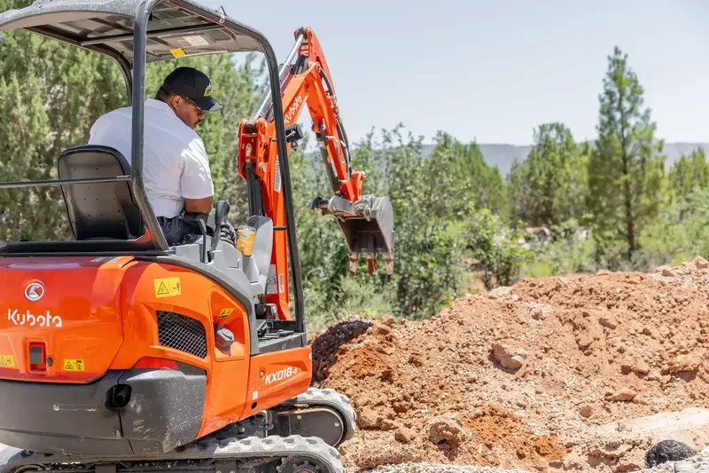Element operator running a mini excavator in St. George, UT