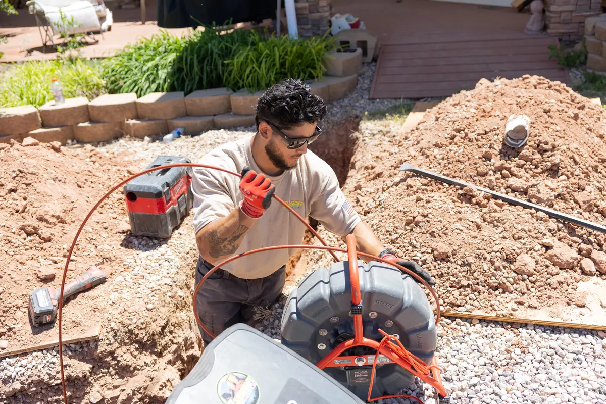 Element plumber guiding a sewer camera line in St. George, UT