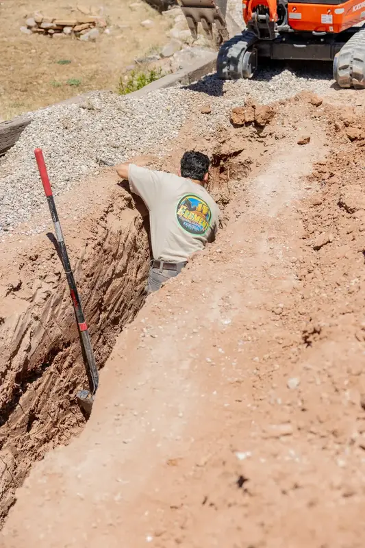 Element plumber inspecting a trench line in St. George, UT