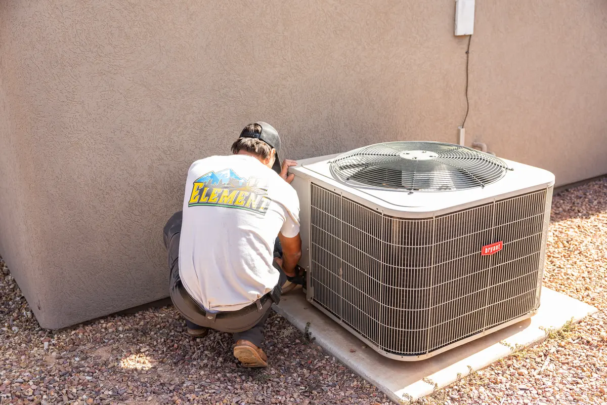 Element technician checking an outdoor AC unit in St. George, UT