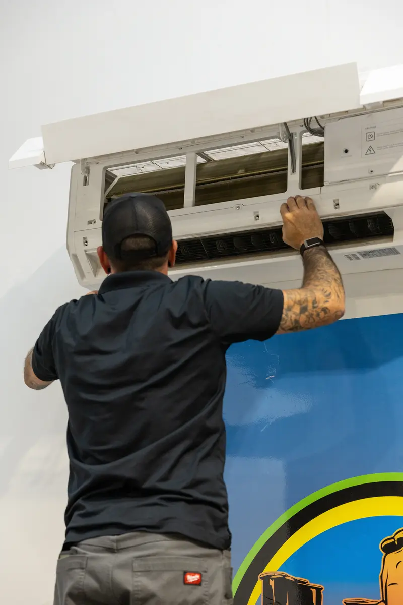 Element technician cleaning a mini split indoor unit in St. George, UT
