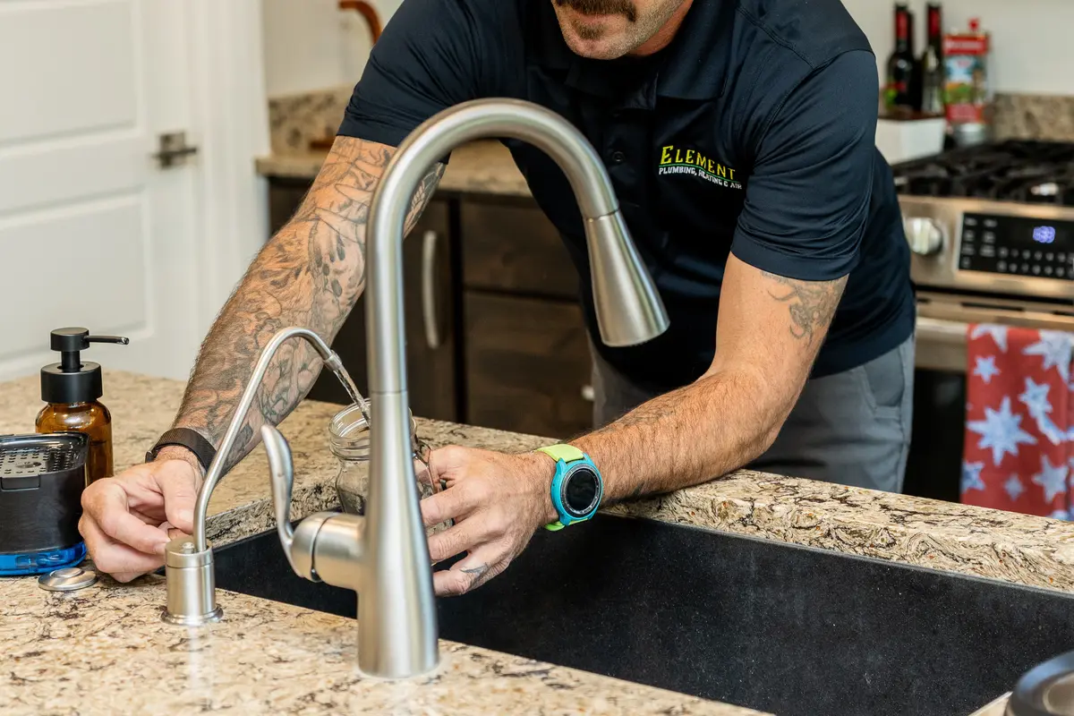 Element technician installing a filtered water faucet in St. George, UT