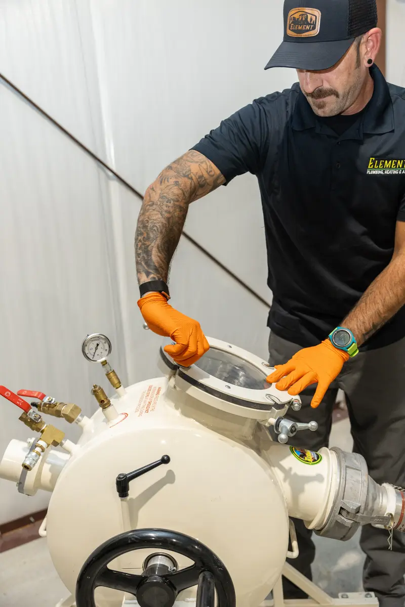 Element technician servicing a whole home filter housing in St. George, UT