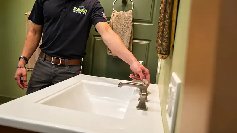 Element technician testing a bathroom faucet in St. George, UT