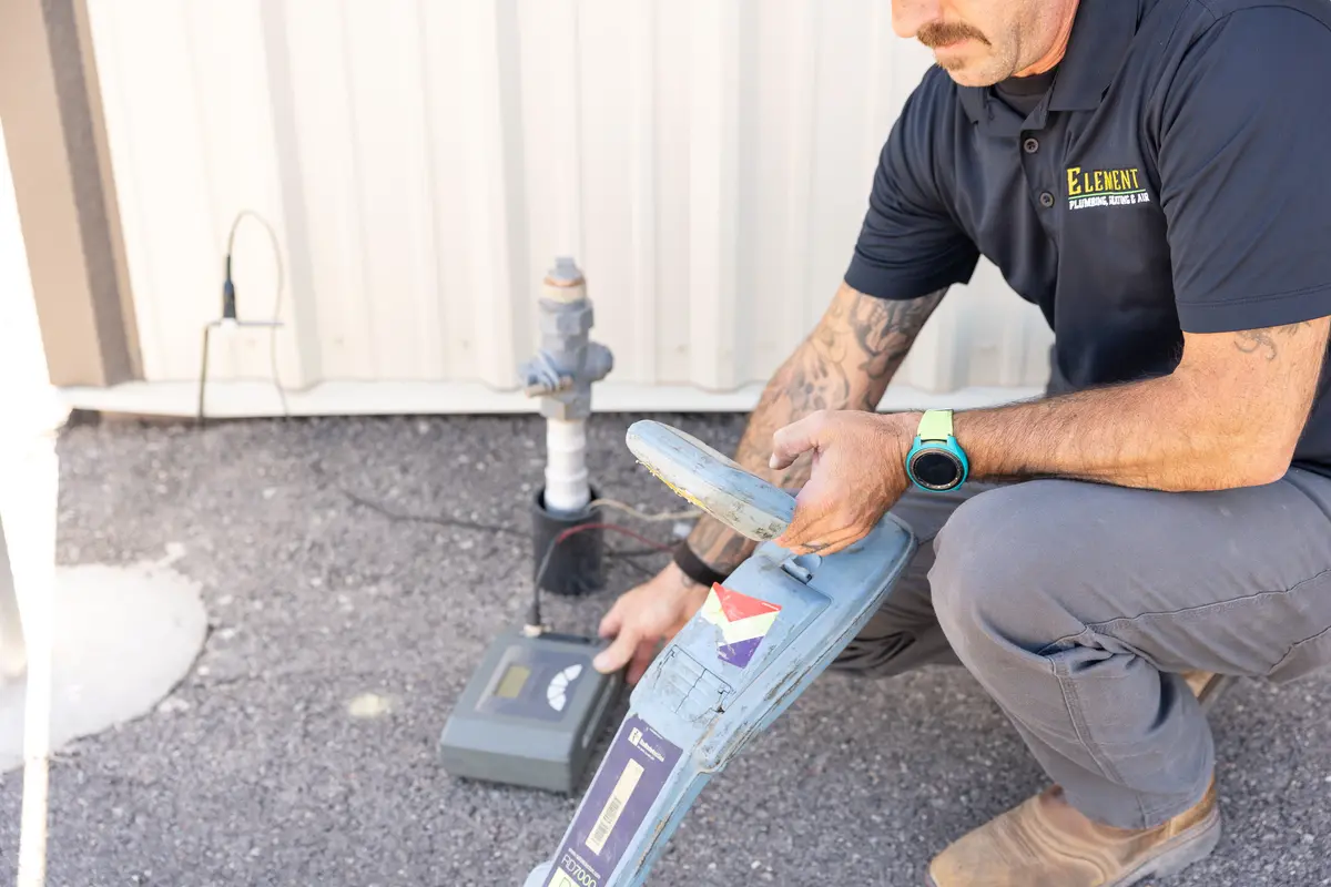 Element technician using a pipe locator in St. George, UT