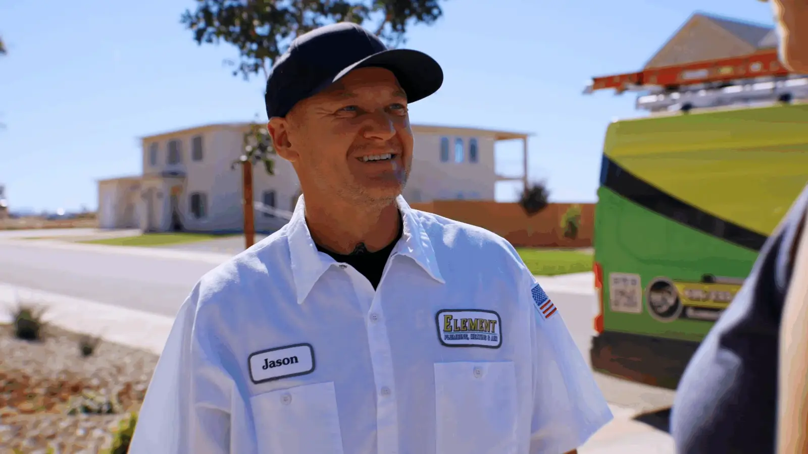 Jason from Element Plumbing Heating speaking with a customer during a residential service visit in St. George UT